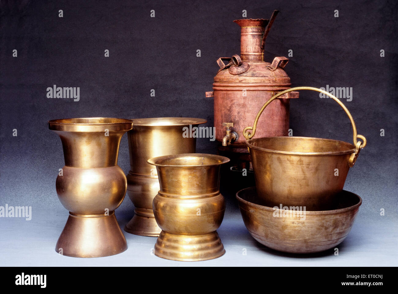 Traditional spittoons bucket and copper water heater in Nattukottai chettiar or nagarathar ; Chettinad ; Tamil Nadu ; India Stock Photo