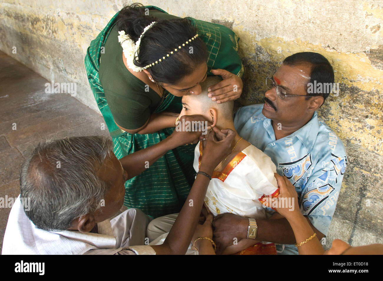 Ear boring ceremony ; Tamil Nadu ; India MR#777A Stock Photo