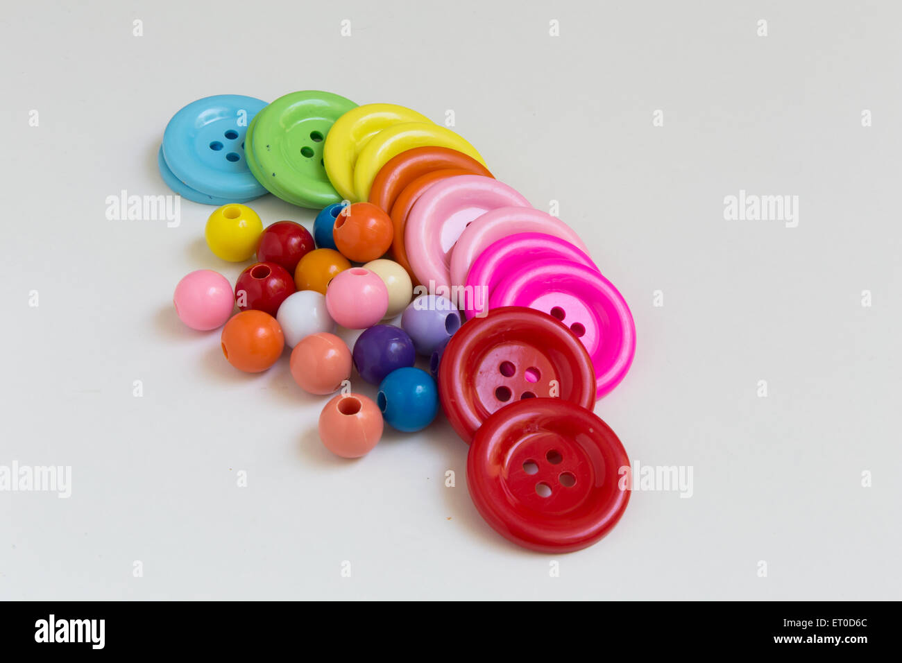 Beading mat with finished designs, needles and colourful beads Stock Photo  - Alamy