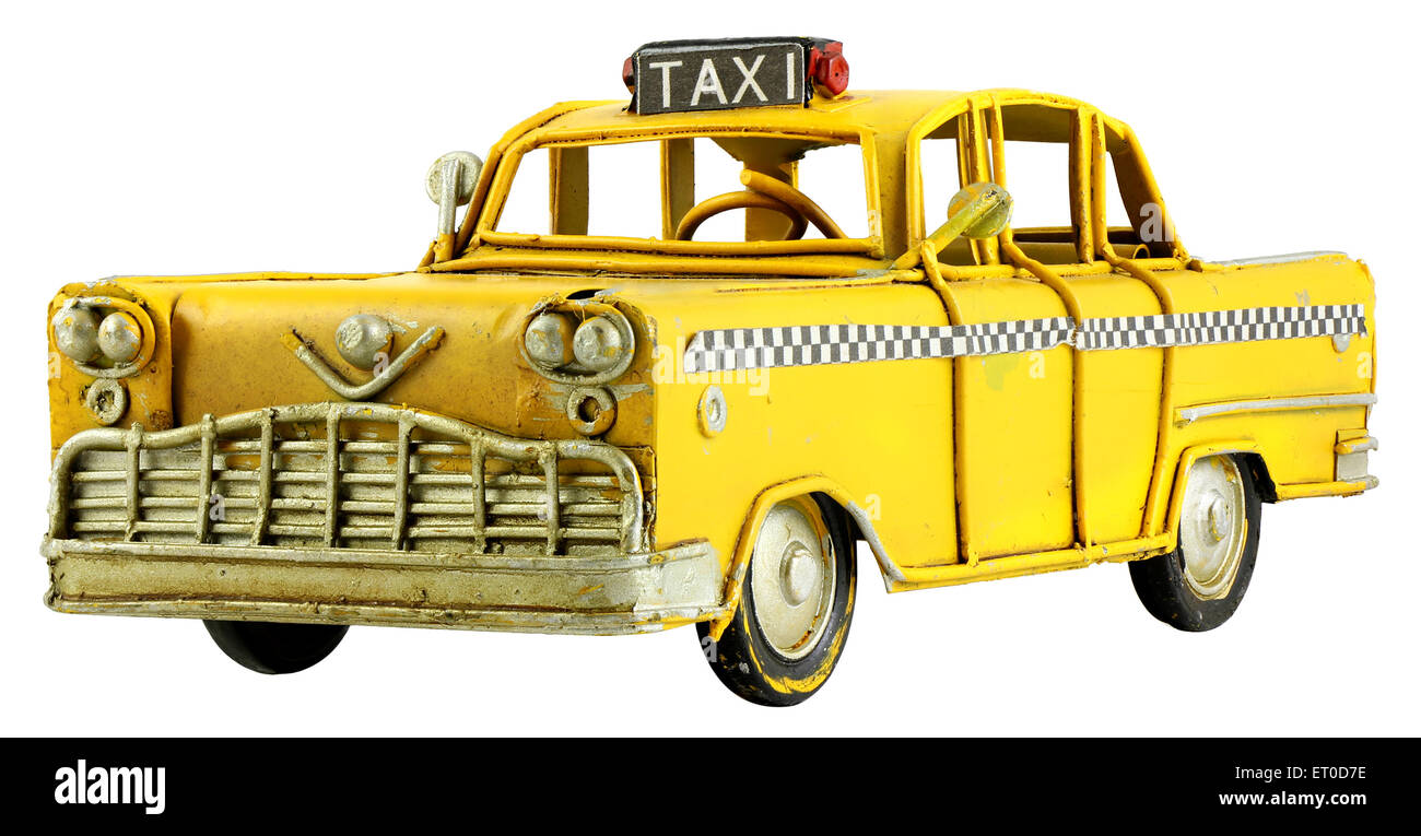 Old retro toy yellow taxi isolated on white background Stock Photo