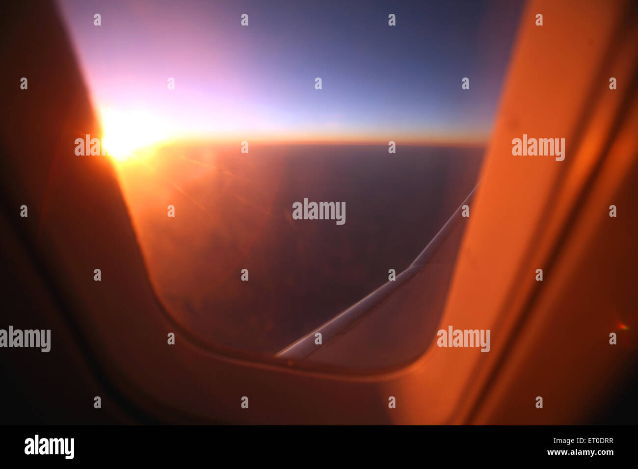 aeroplane window view of airplane wing Stock Photo