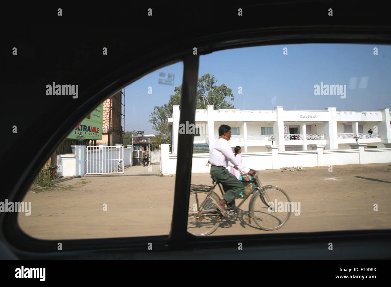 Man riding bicycle seen from window of ambassador car, Ranchi, Jharkhand, India, Indian life Stock Photo