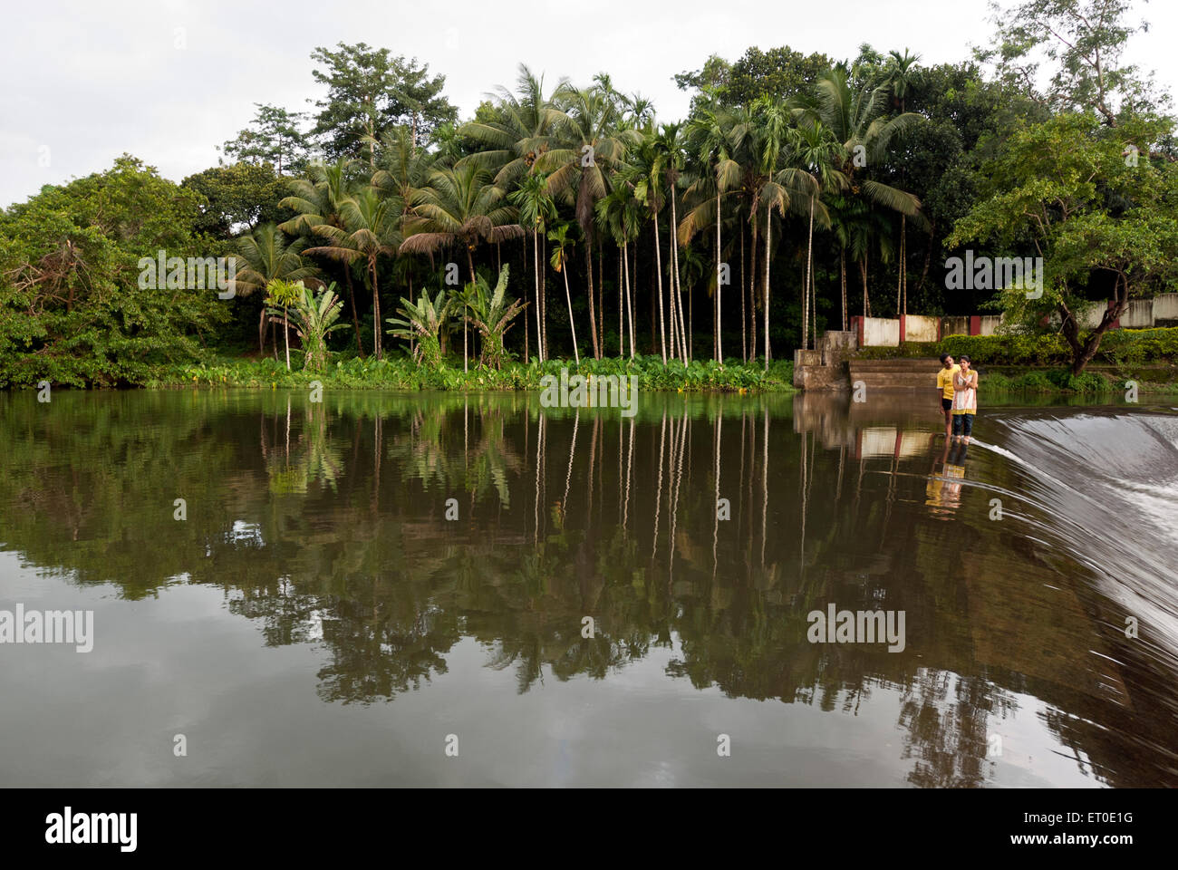 Couple at ezhattumugham ; Athirappilly Athirapally ; Trichur Thrissur ; Kerala ; India 777K;777L Stock Photo