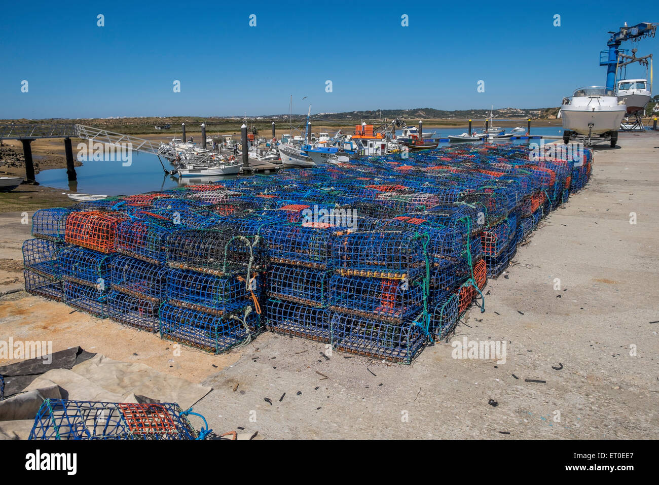 Fishermens lobster pots lined up on the quayside waiting to go on board a fishing boat, Stock Photo
