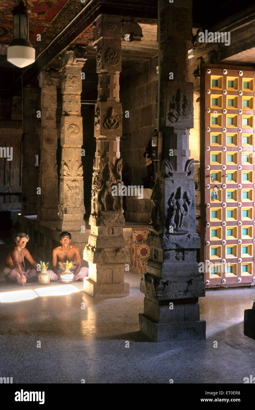 Sculpted pillars wooden doors Soorakudi Shiva temple 1 of the 9 clan temples of chettinad Tamil Nadu INDIA Stock Photo