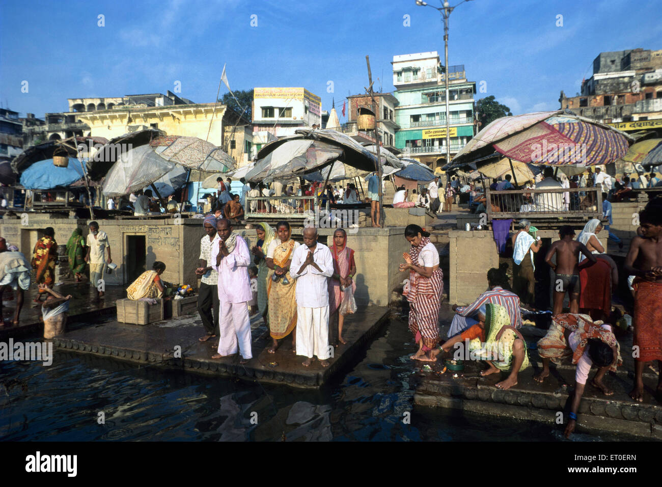 People praying sun God, Kashi, Banaras, Varanasi, Uttar Pradesh, India, Asia Stock Photo