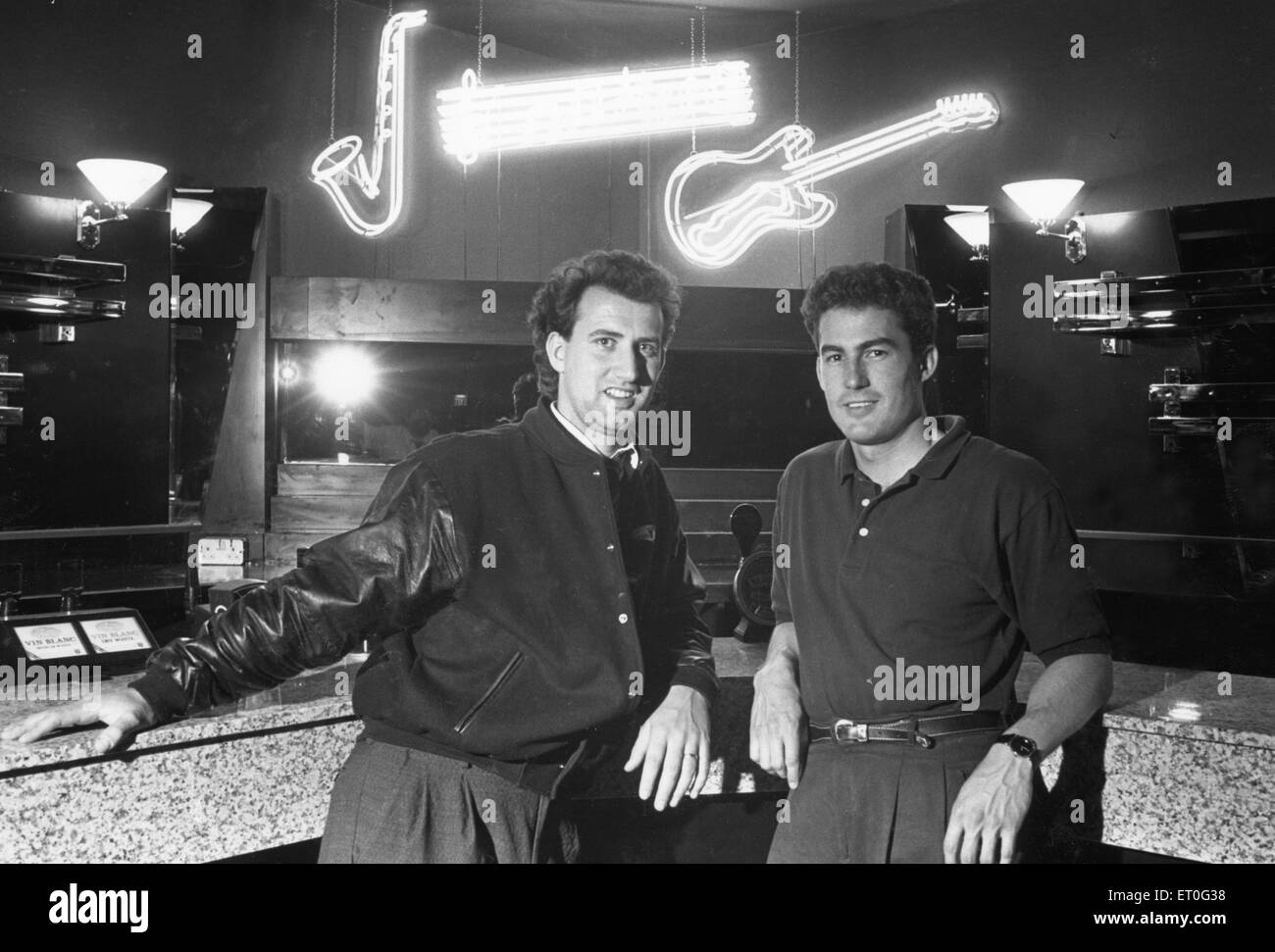Disc jockey Pez (left) and manager Steve Fleury seen here in the cocktail bar of the Bedrock night club 17th June 1989 Stock Photo