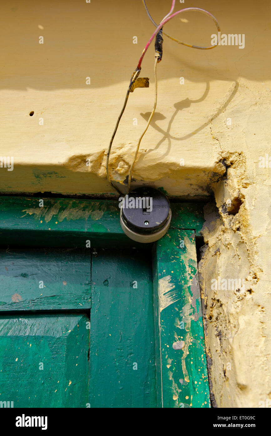 Green wooden door and old switch , Rajpur , Dehradun , Uttaranchal ,  Uttarakhand , India , Asia Stock Photo