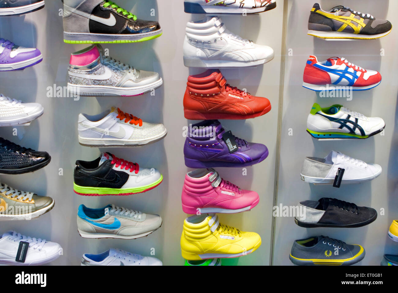 Shoe display, colorful decorative shoes for sale in store ; London ; UK ,  United Kingdom , England Stock Photo
