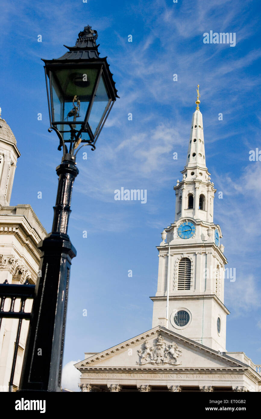 Clock tower and lamppost ; Trafalgar Square ; London ; UK United Kingdom England Stock Photo