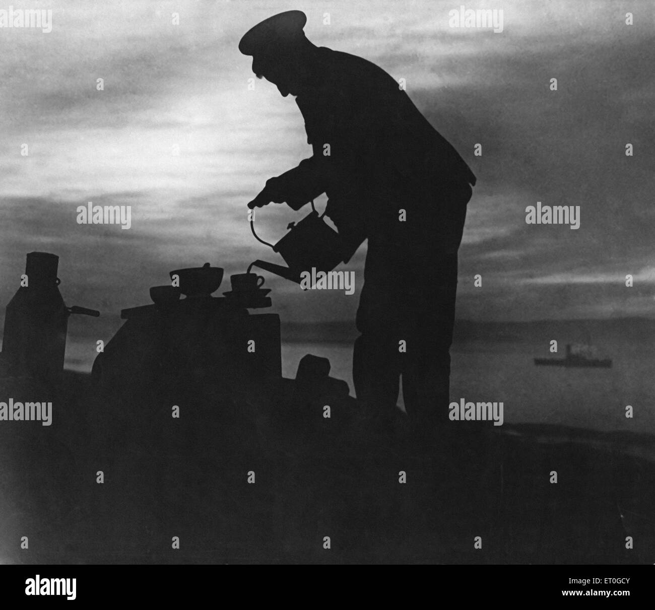 Soldier prepares early morning tea at Suvla Bay during the evacuation. Circa December 1915 Stock Photo