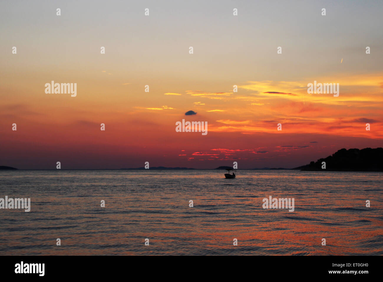 Fishing boat in sunset sea hi-res stock photography and images - Alamy