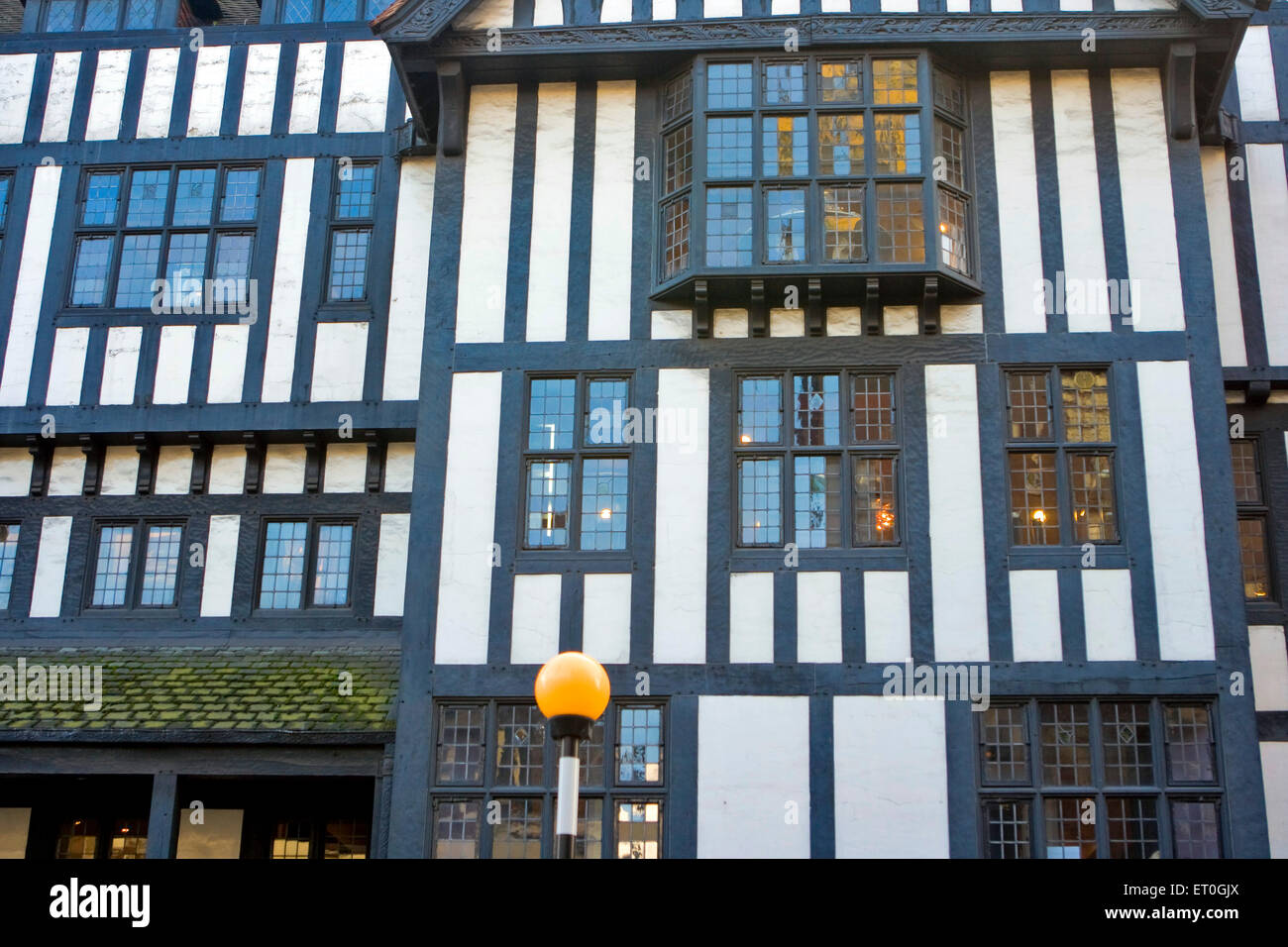 Tudor houses windows , yellow lamp post , London , England , UK , United Kingdom Stock Photo