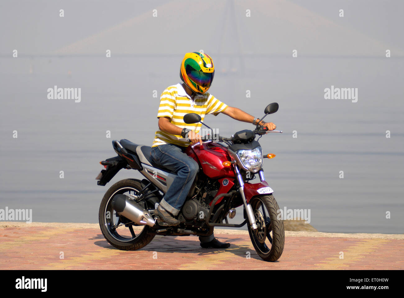 Young Boy In Helmet Riding Red Coloured Yamaha Fz Motorcycle 150cc Stock Photo Alamy