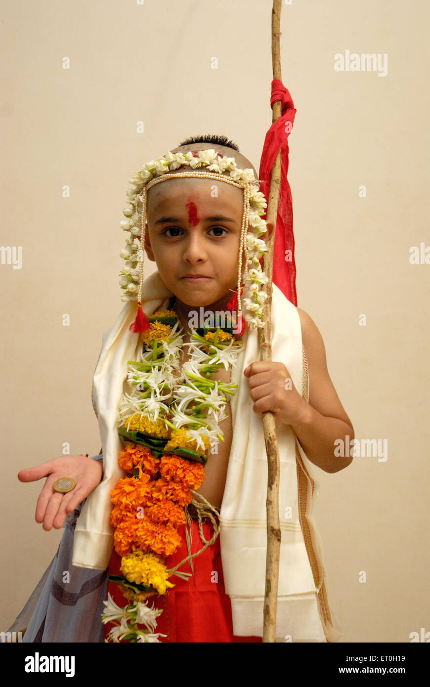 Indian bald head eight year old boy on thread ceremony - Model Release Number # 721 Stock Photo