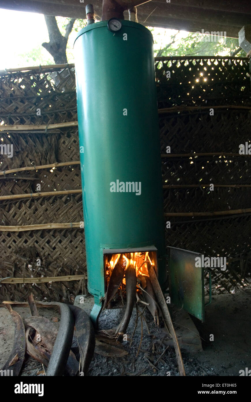 old wood burning water heater, old wood fired water heater, Bordi, Palghar, Maharashtra, India, Asia Stock Photo