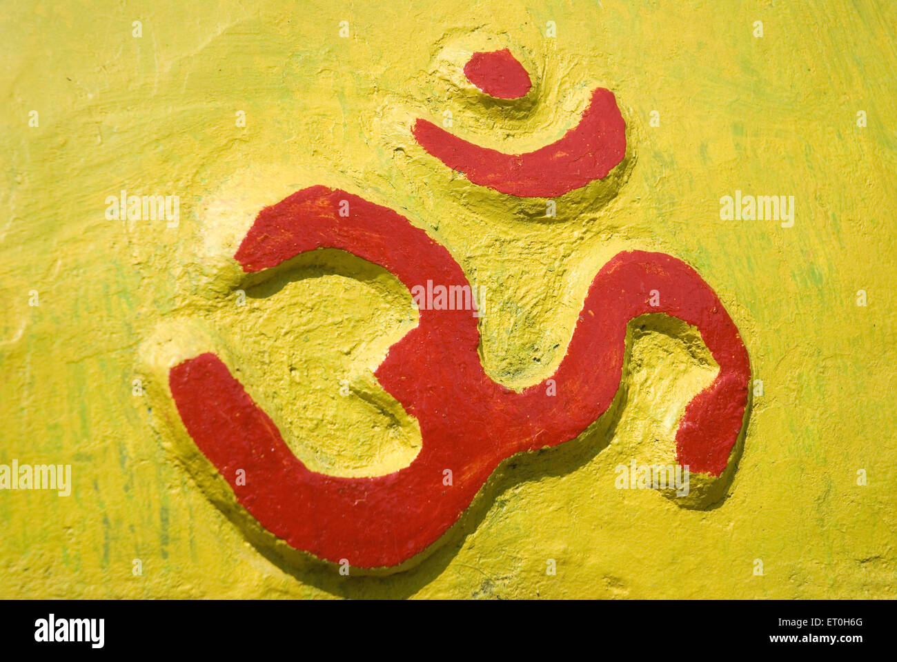 Om symbol painted wall relief ; Yellapur ; Karnataka ; India , asia Stock Photo