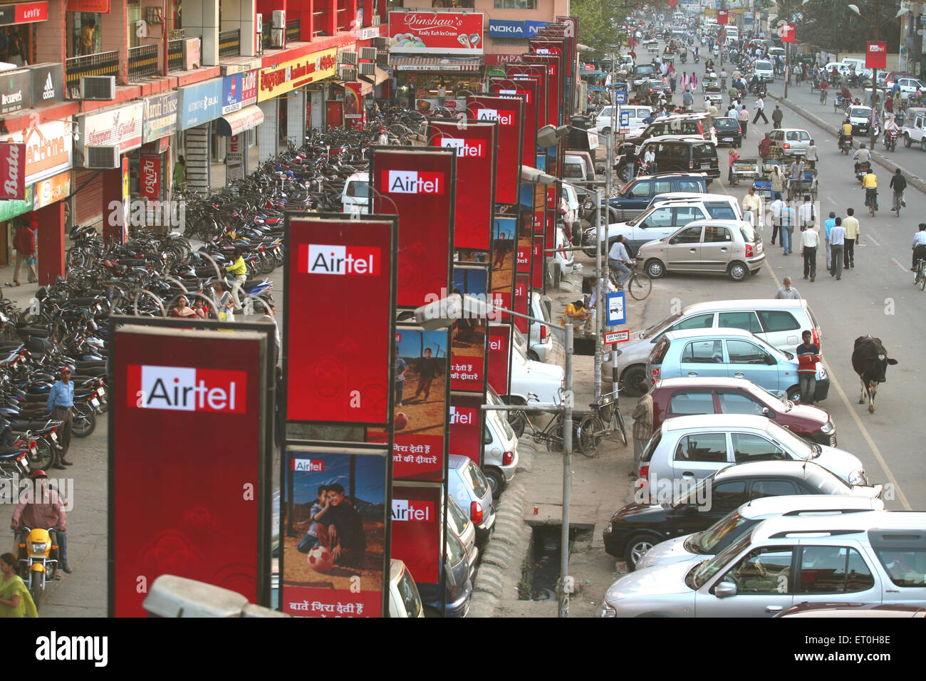 Busy street with hoardings of Airtel phone company in Ranchi city capital of Jharkhand ; India Stock Photo