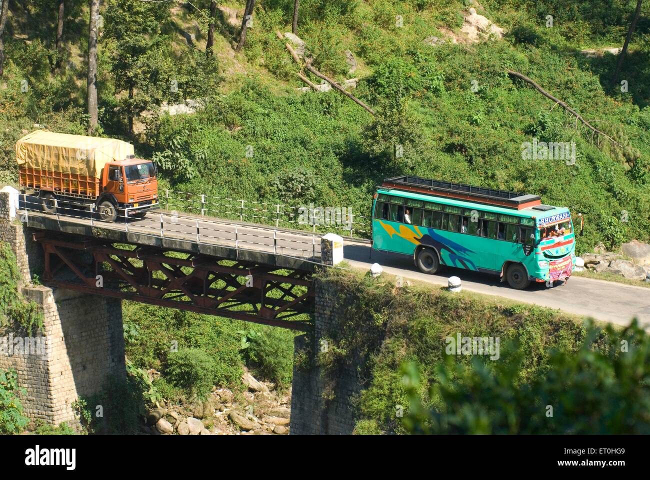 Vehicles crossing bridge over beas river at palanpur ; Himachal Pradesh ; India Stock Photo