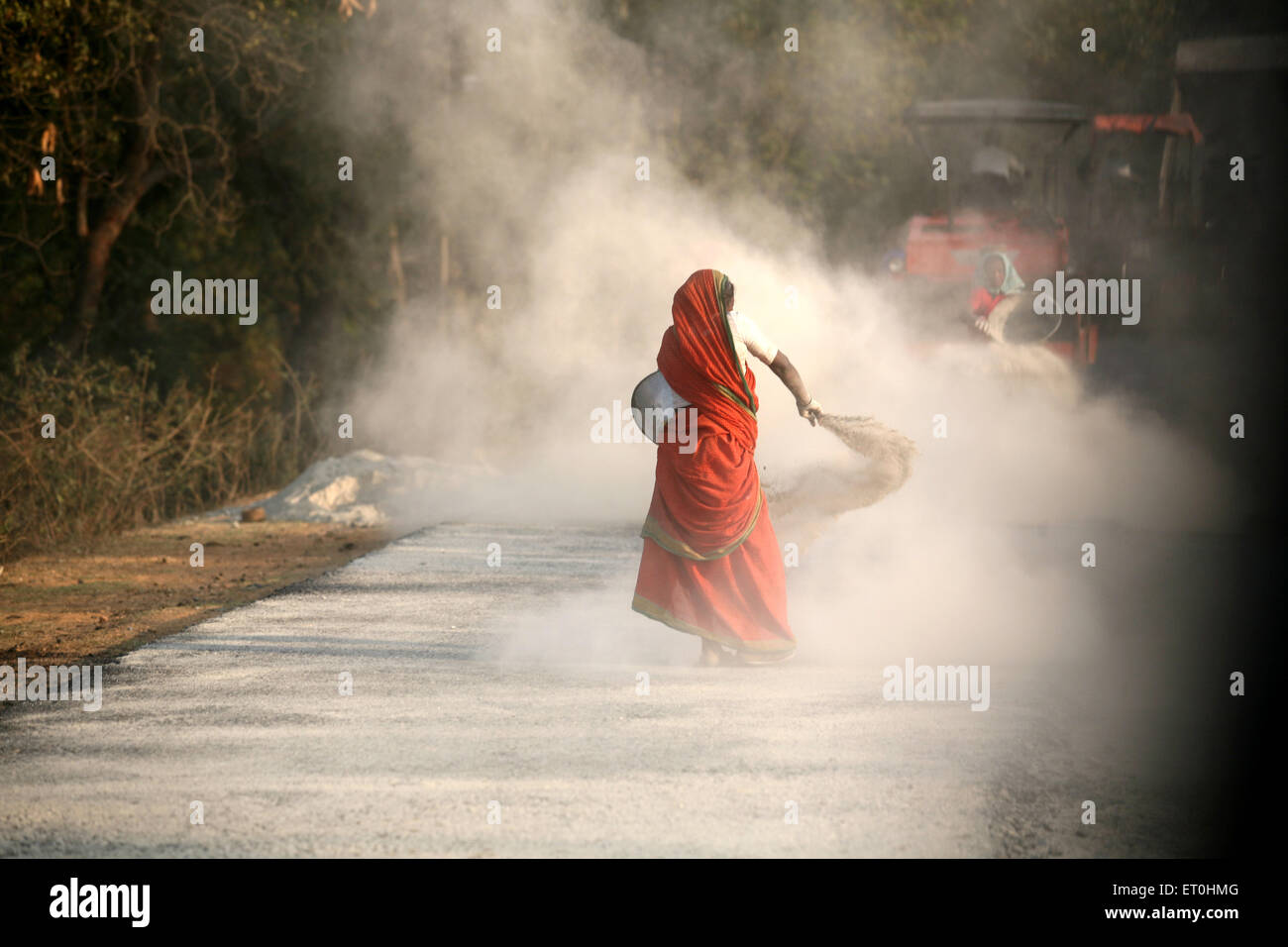 Lady working at road construction site in Jharkhand ; India Stock Photo