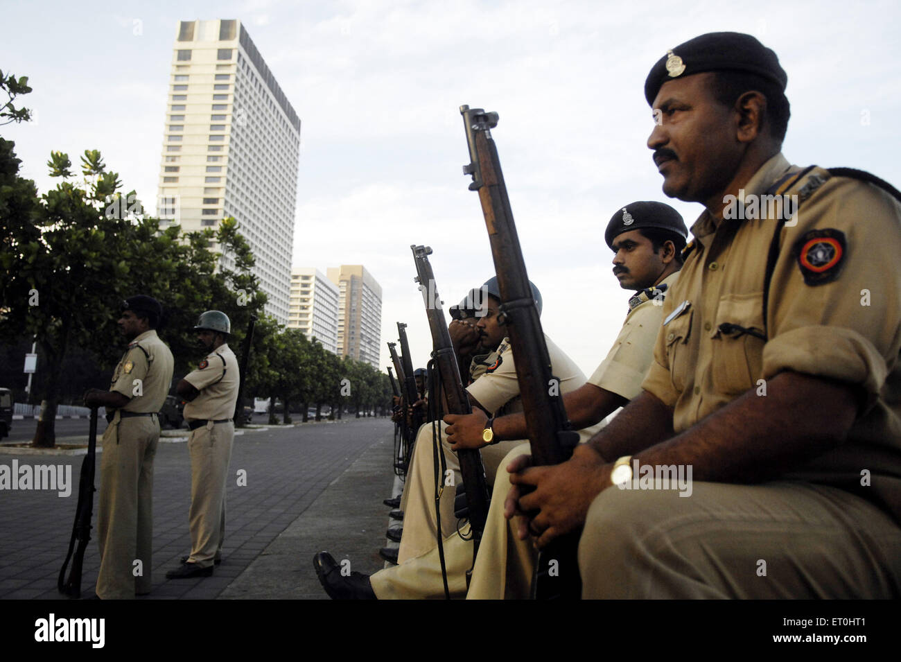 Police waiting to fight Deccan Mujahideen terrorists inside Oberoi (Trident hotel) Nariman Point ; Bombay Mumbai Stock Photo