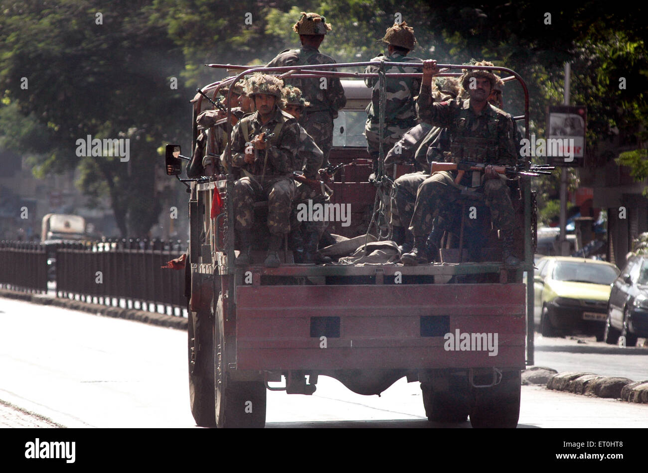Indian Army in trucks came to fight with Deccan Mujahideen terrorists in Bombay Mumbai ; Maharashtra ; India 27 November 2008 Stock Photo