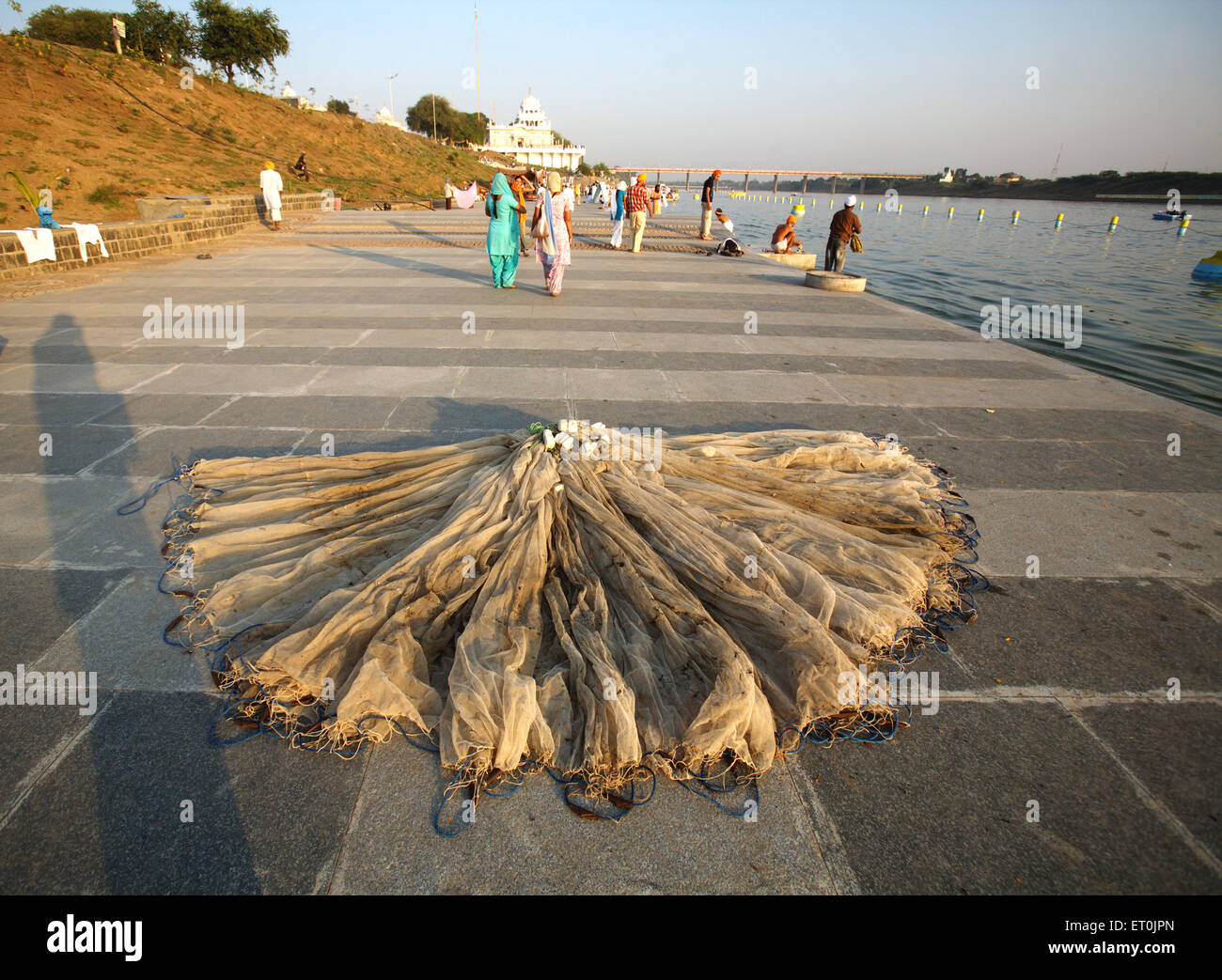 Fish net kept on promenades of 15 km long Ghat of river Godavari where pilgrims taking holy bath ; Nanded ; Maharashtra Stock Photo