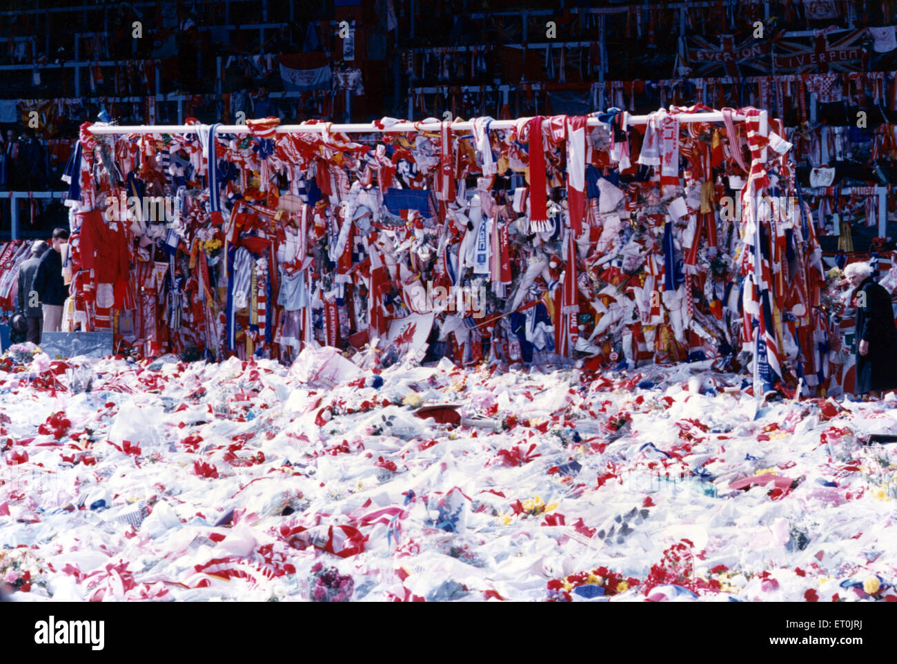 The goalmouth on the pitch at Anfield, covered with Liverpool and Everton scarves and flags as a mark of respect to the many Liverpool fans who lost their lives at Hillsborough only a few days before. 18th April 1989. Stock Photo