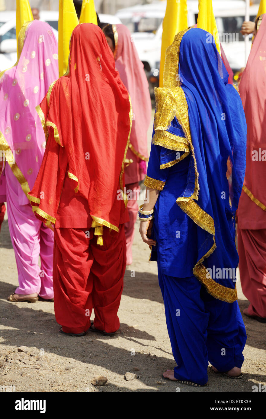 Young Sikh girls in traditional salwar kameez ; cultural events ; consecration of perpetual Guru Granth Sahib ; Nanded Stock Photo