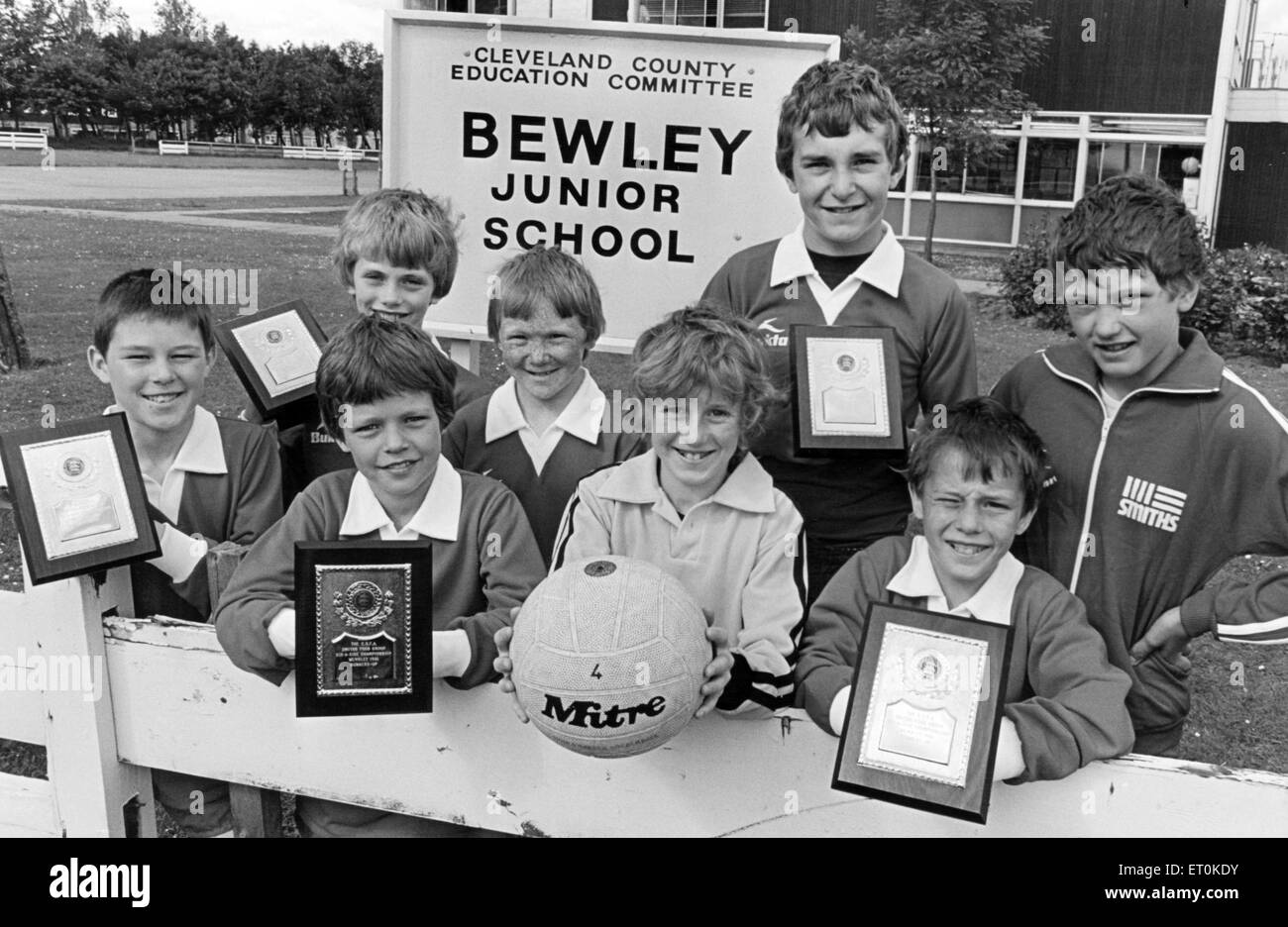 The Bewley Junior School's six-a-side soccer team proudly display their runners-up plaques after losing to Enfield in the final of the English School's FA national competition for under 11's at Wembley. They are, (front row left to right): Ian Grey, Paul Lambert, Sean Fay, Jason Hurt, back row (left to right) Andrew Gustard, Geoffrey McCreesh, Gary Pugh, Michael Armstrong. 15th June 1981. Stock Photo