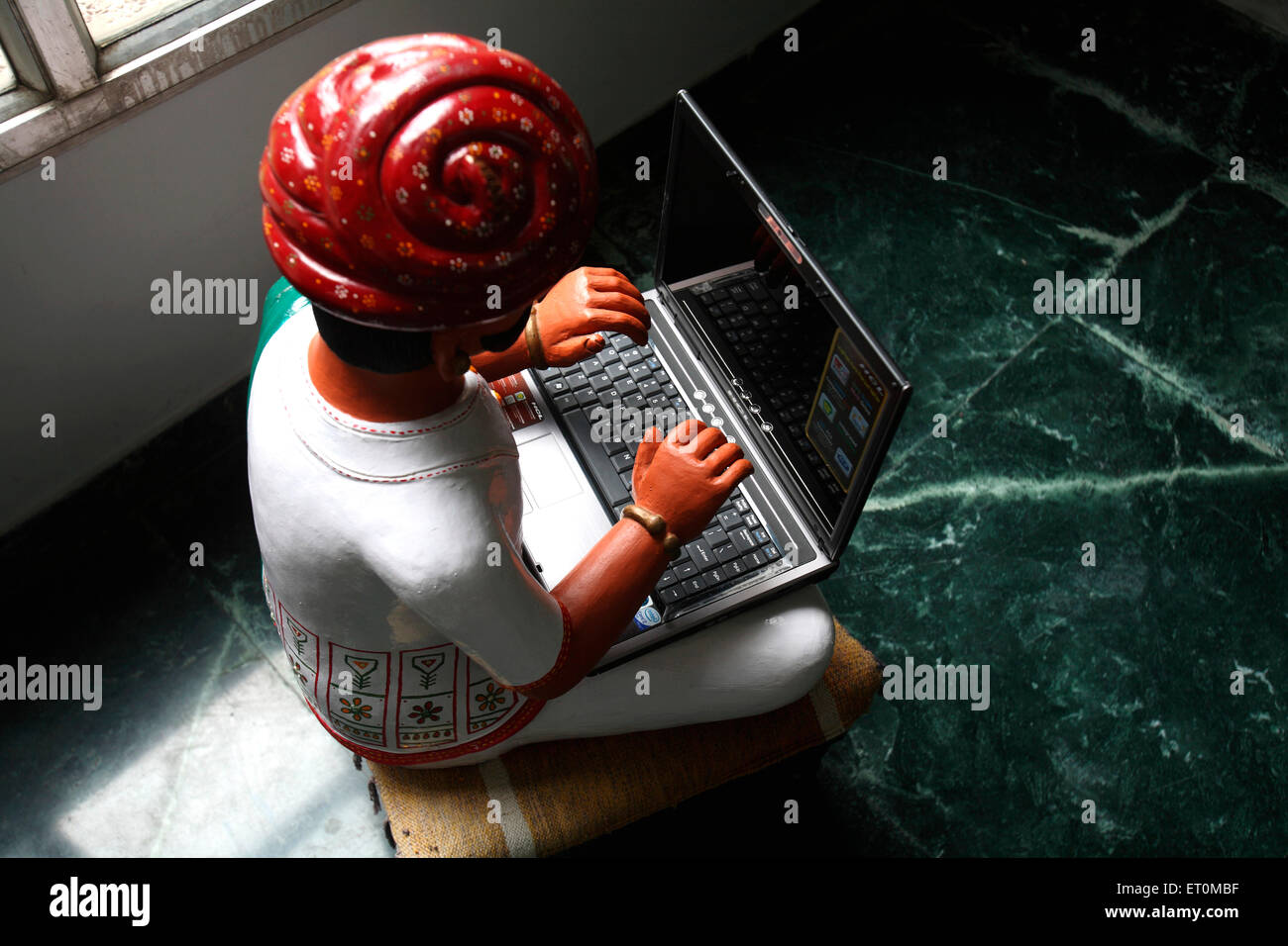 man on computer clay statue, Amul Factory, Anand, Gujarat, India Stock Photo