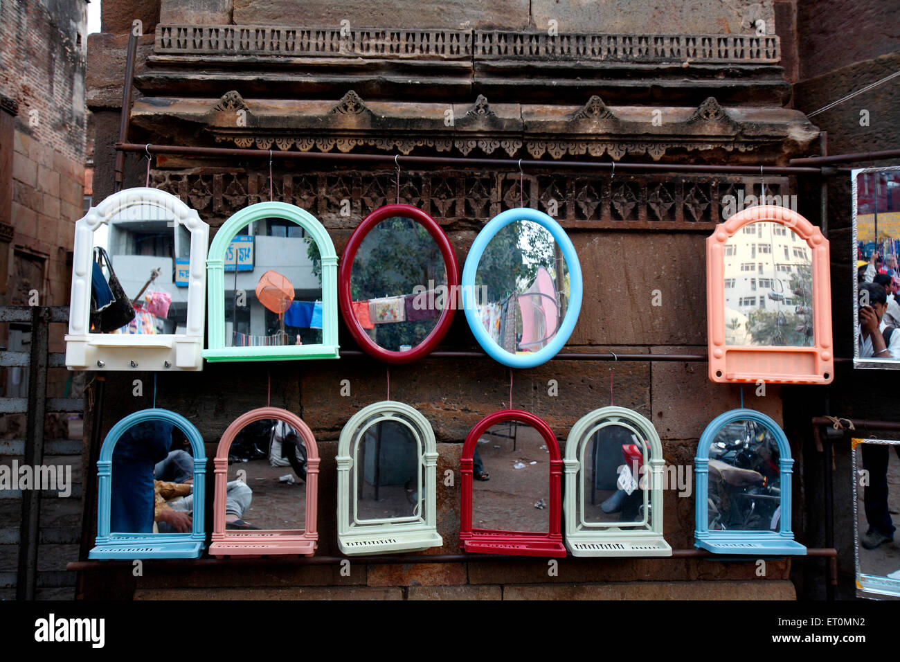 Mirrors for sale put on walls of Bhadra fort in Ahmedabad ;  Gujarat ;  India Stock Photo
