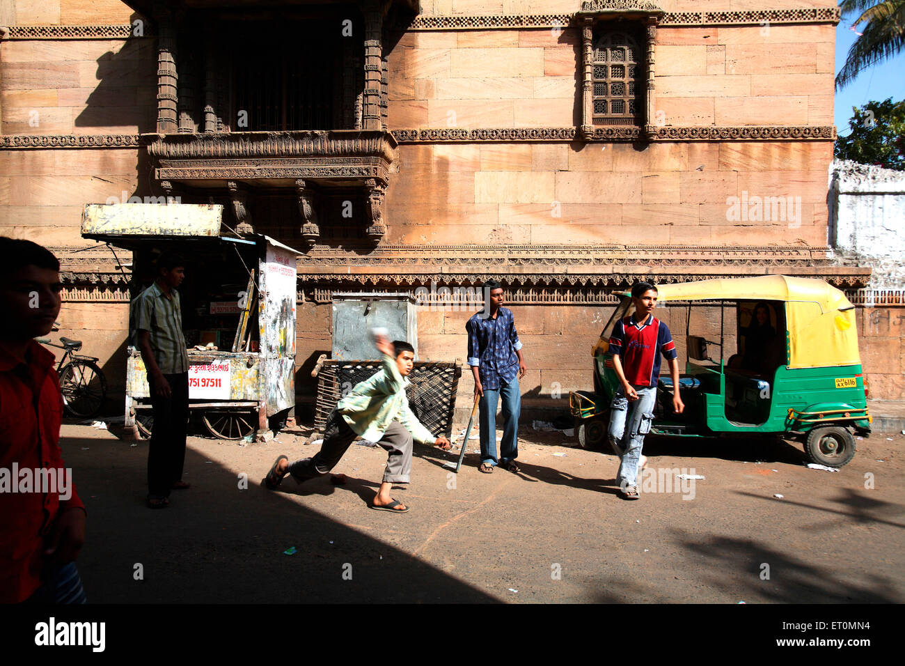 Children playing cricket near  Rani Rupmati mosque ;  Ahmedabad ; Gujarat ; India NO MR Stock Photo