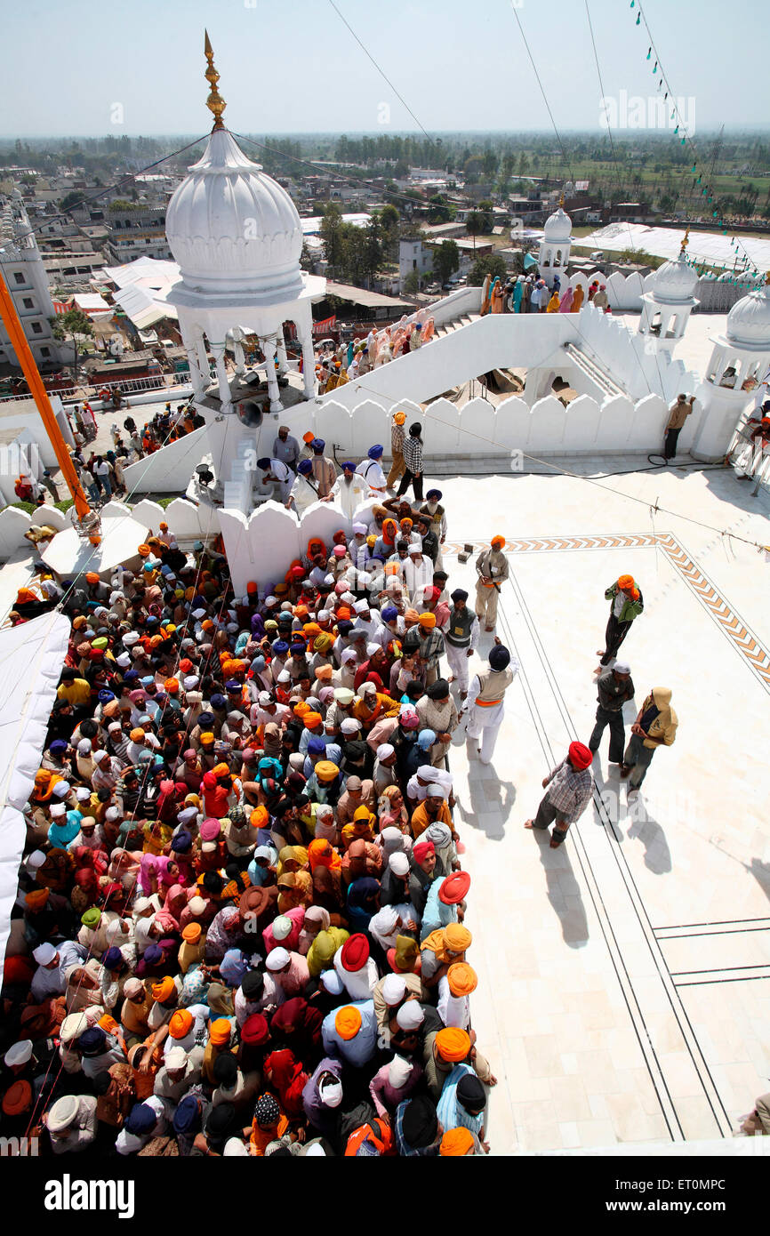 Crowds of devotees in queues during festival of Hola Mohalla at Anandpur Sahib Gurudwara in Rupnagar district ; Punjab ; India Stock Photo