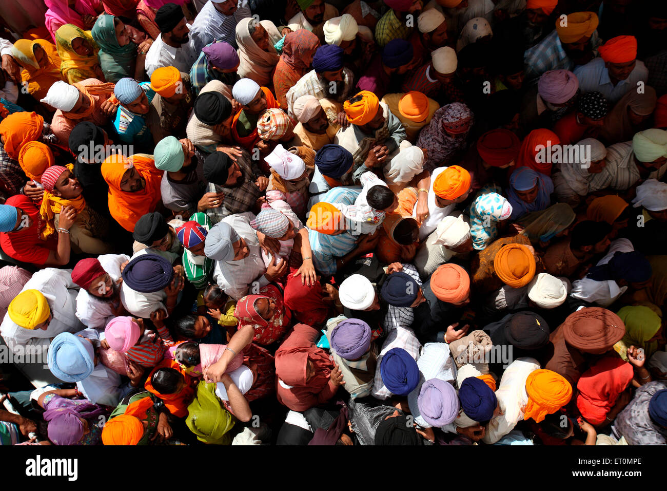 Crowds of devotees in queues during festival of Hola Mohalla at Anandpur Sahib Gurudwara in Rupnagar district Punjab India Stock Photo
