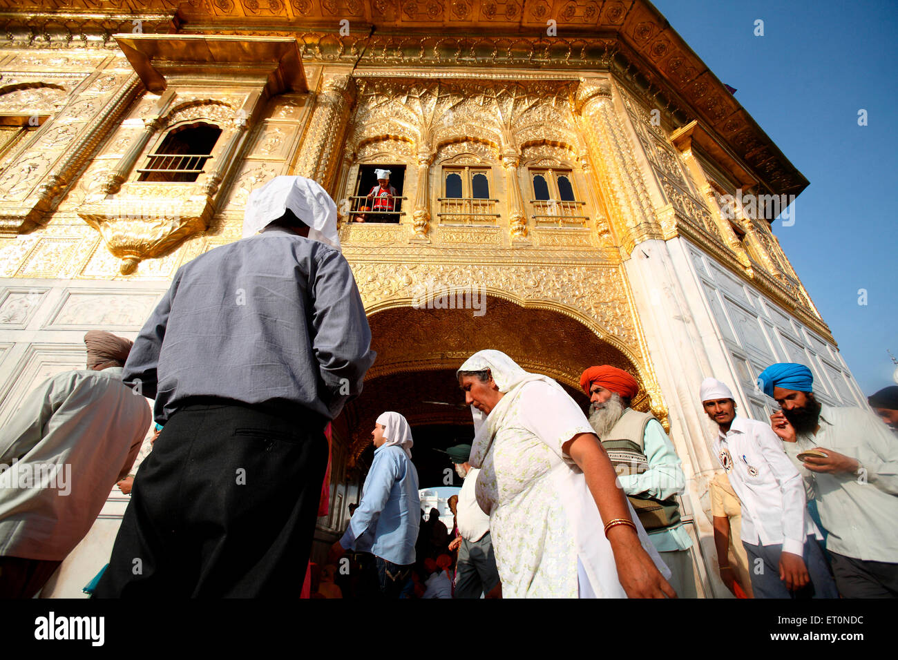 Devotees at Harmandir Sahib or Darbar Sahib or Golden temple in Amritsar ; Punjab ; India Stock Photo