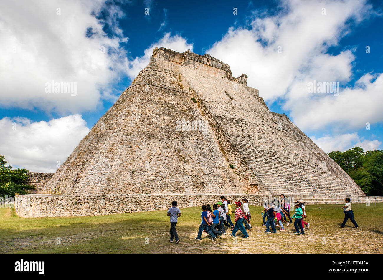 Children at Piramide del Adivino (Magicians House), Maya ruins at Uxmal archaeological site, Yucatan Peninsula, Mexico Stock Photo