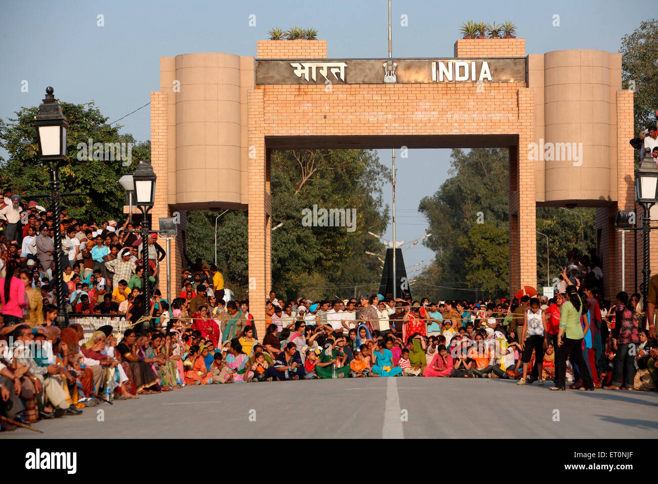 Crowds sitting to watch changing of guard ceremony at Wagah border ; Amritsar ; Punjab ; India Stock Photo
