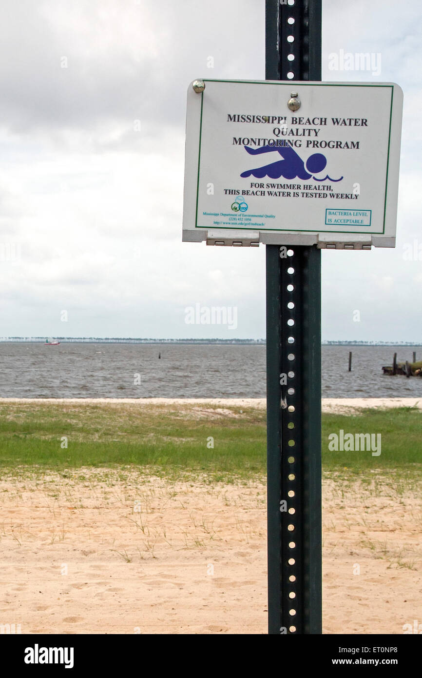 Ocean Springs, Mississippi - A sign on the Gulf of Mexico beach announces a water quality testing program. Stock Photo