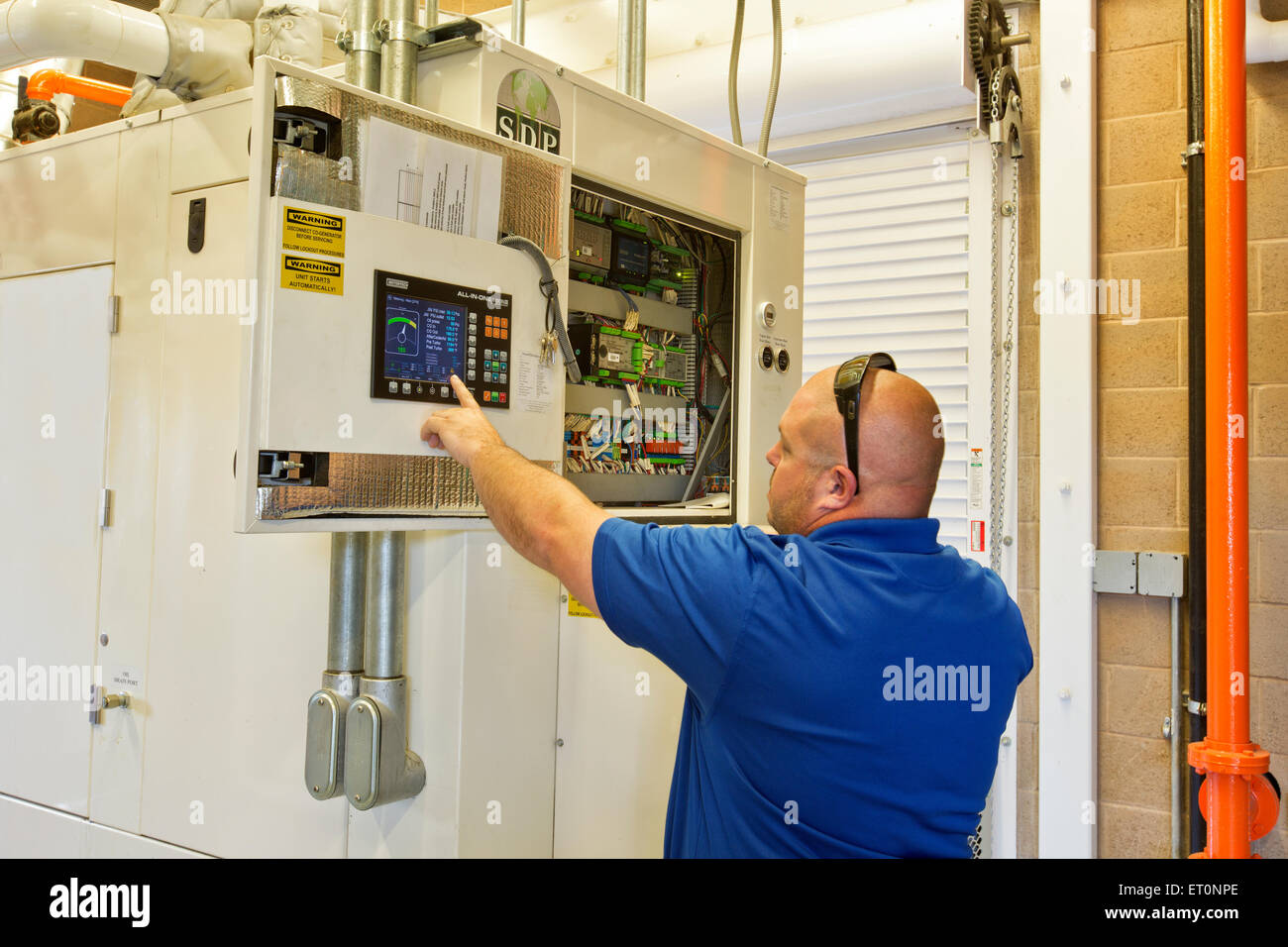 Engineer checking  control panel, Digester Control Building, Stock Photo