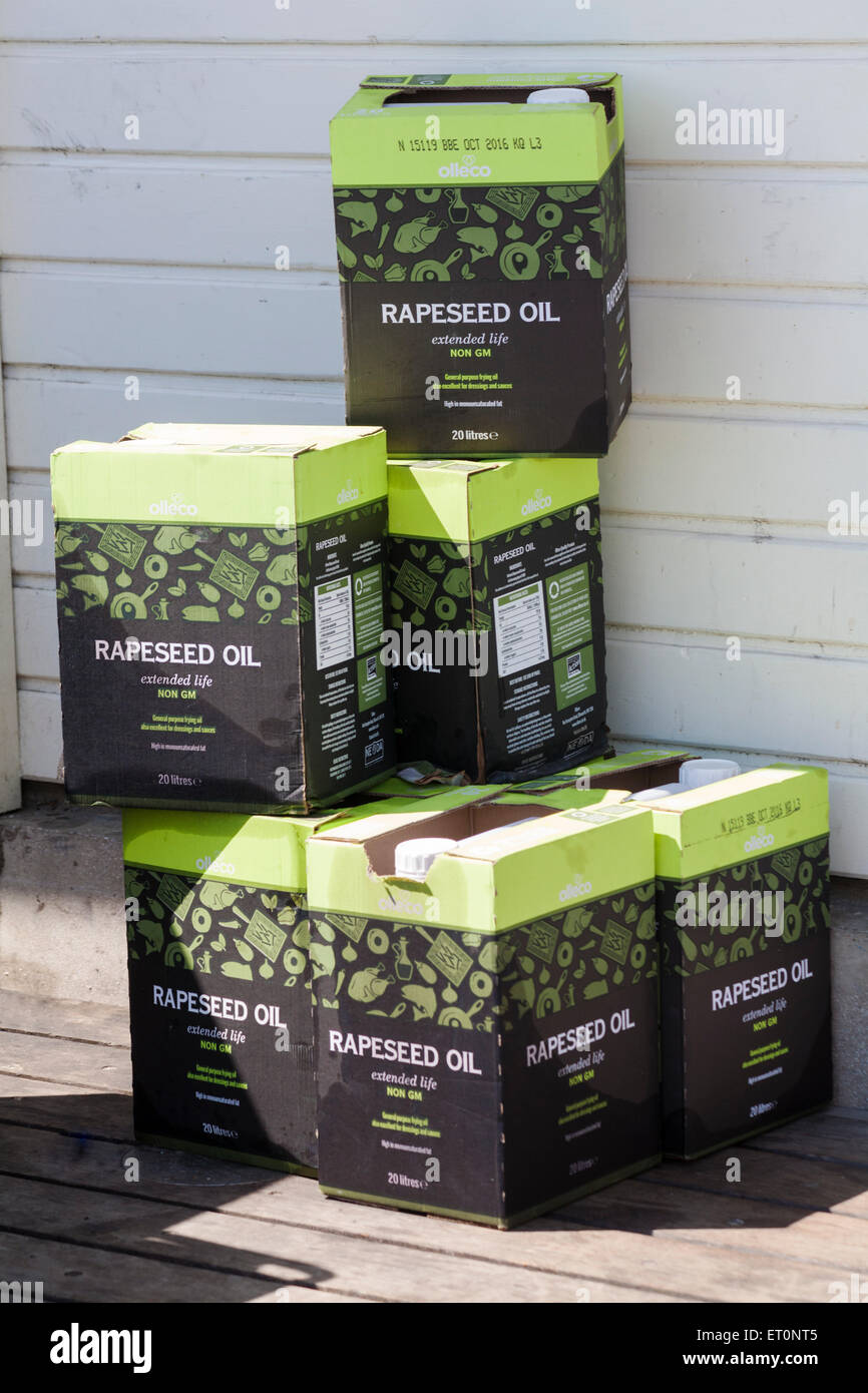 Boxes of Olleco Rapeseed Oil extended life non GM stacked outside cafe