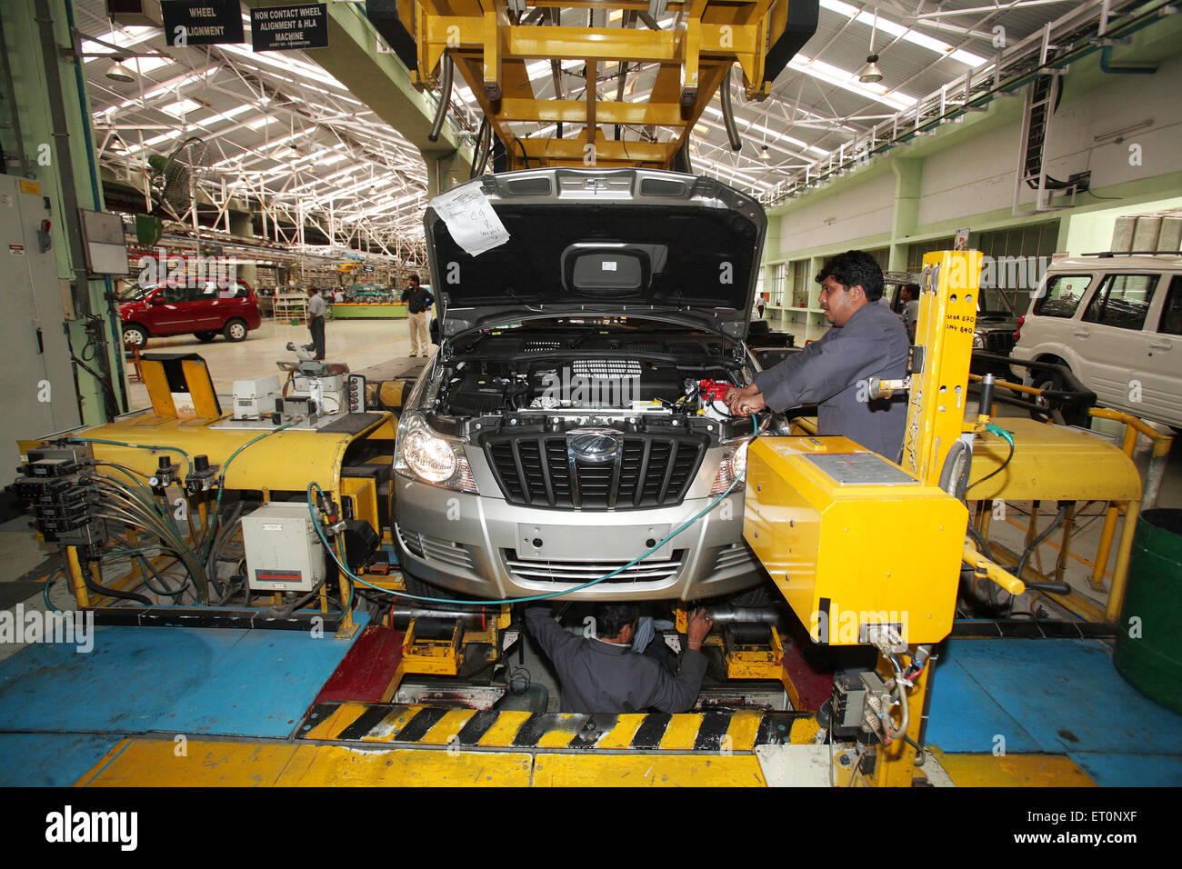 car manufacture assembly line man working India Indian car factory Asia Asian automobile industry Stock Photo