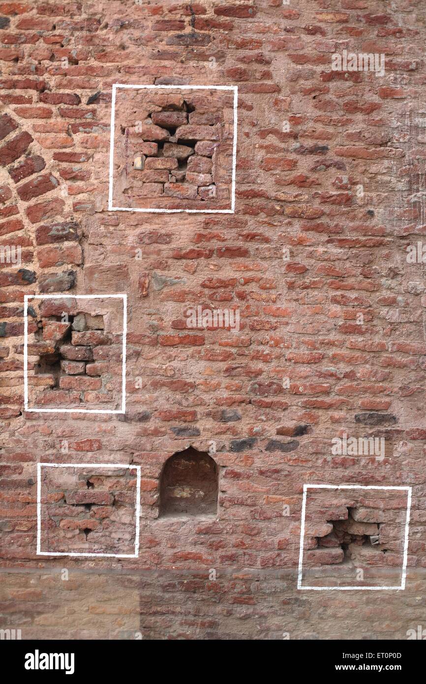 Bullet marks visible on preserved wall at Jalianwala Bagh ; Amritsar ; Punjab ; India Stock Photo