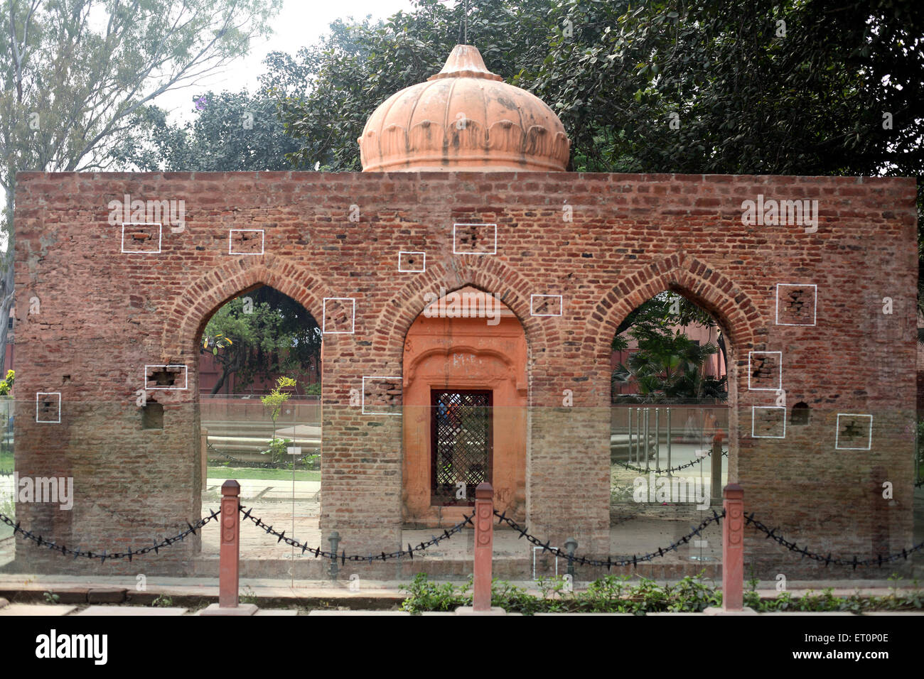 Bullet marks visible on preserved wall at Jalianwala Bagh ; Amritsar ; Punjab ; India Stock Photo