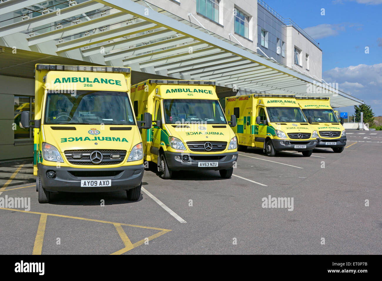 East Of England ambulance service NHS emergency SOS 999 ambulances parked at A&E Broomfield hospital accident & emergency department Essex, England UK Stock Photo