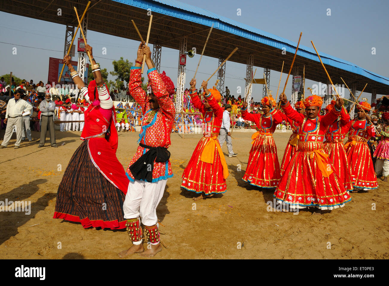 Gair folk dancers dancing at mela ground ; Pushkar fair ; Rajasthan ; India Stock Photo