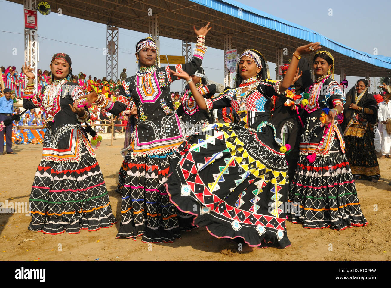 Kalbeliya folk dancers dancing at mela ground ; Pushkar fair ; Rajasthan ; India Stock Photo