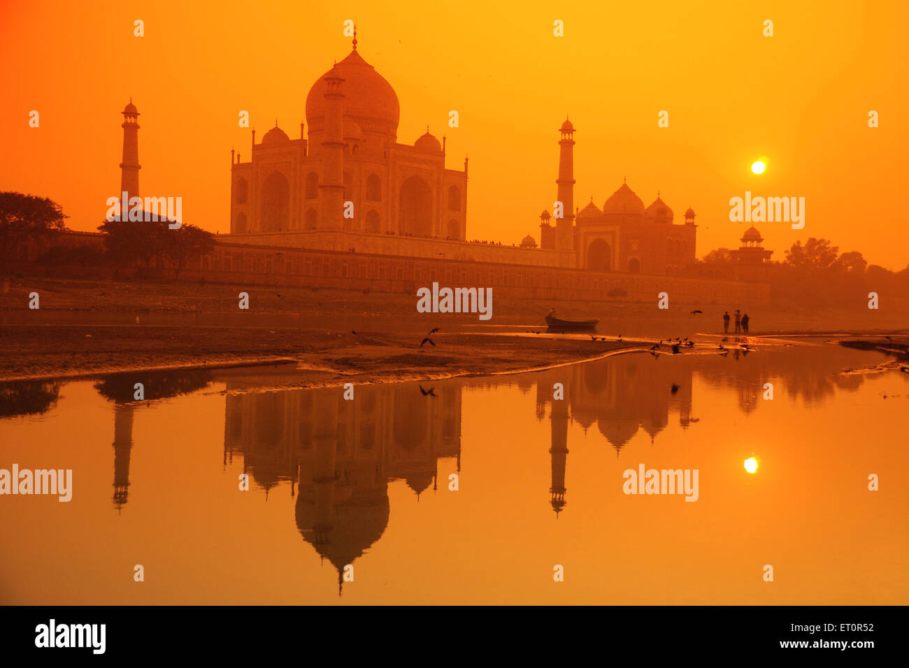 Reflection of Taj Mahal in Yamuna river at sunset ; Agra ; Uttar Pradesh ; India Stock Photo