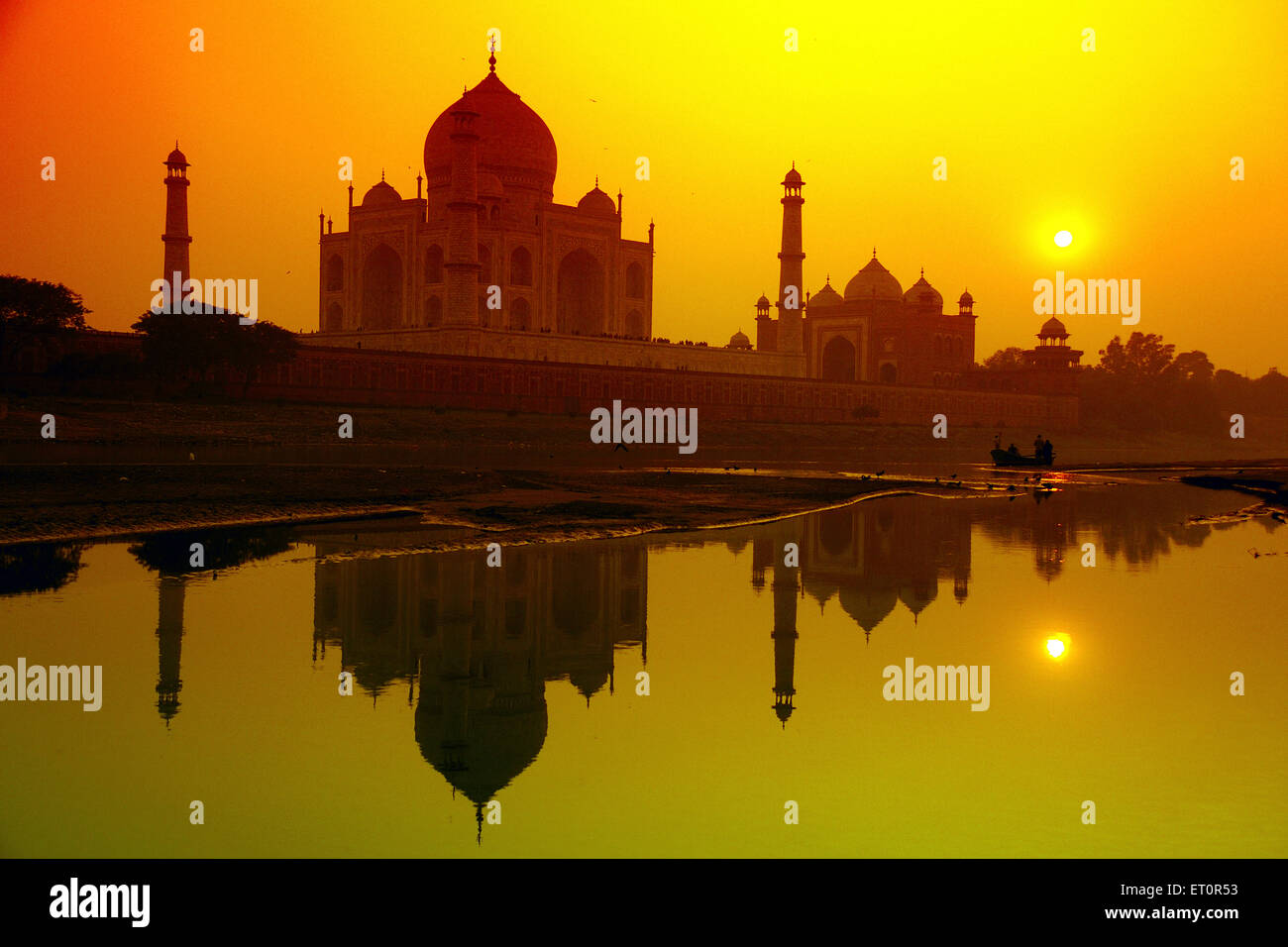 Reflection of Taj Mahal in Yamuna river at sunset ; Agra ; Uttar Pradesh ; India Stock Photo