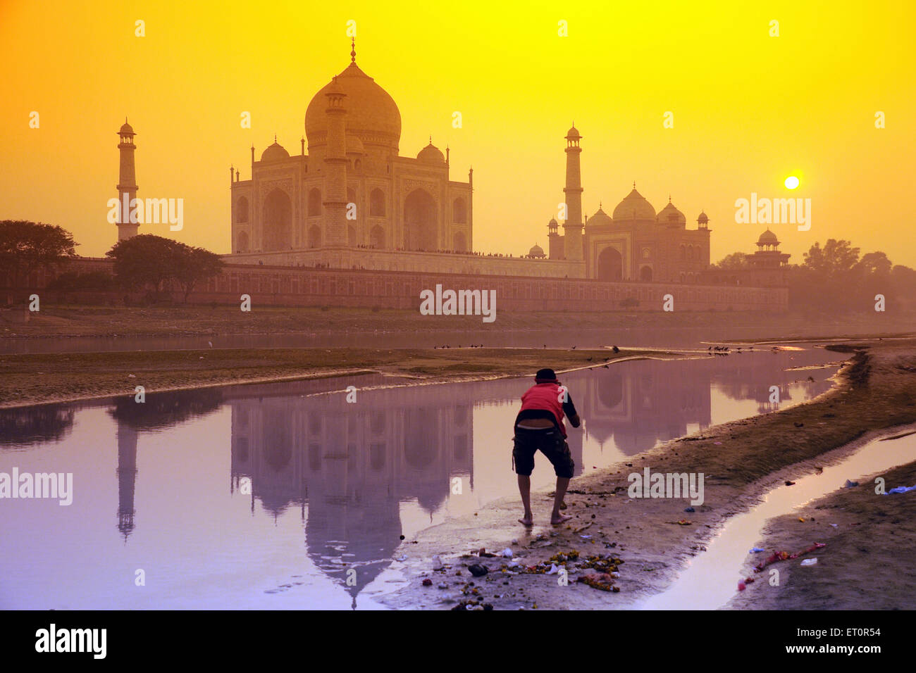 Reflection of Taj Mahal in Yamuna river at sunset ; Agra ; Uttar Pradesh ; India Stock Photo